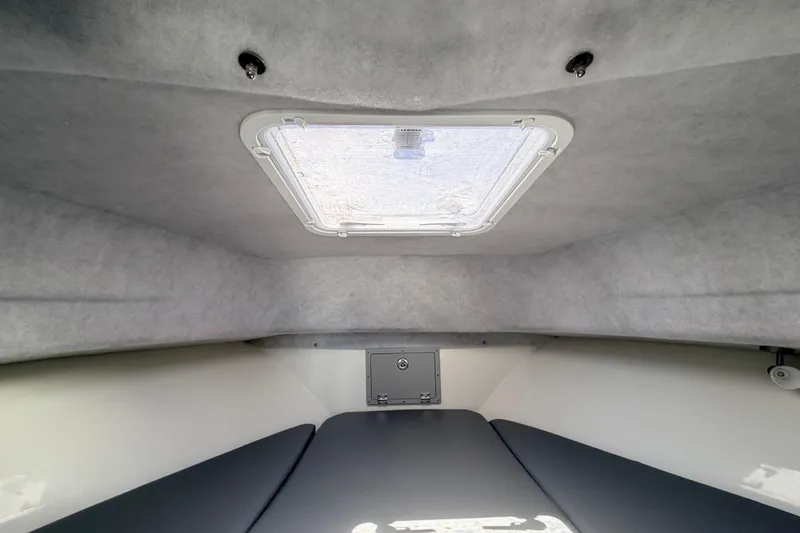 Slide: The Image of Interior cabin of 2026 Defiance Admiral 270 EX boat with overhead hatch. - 56