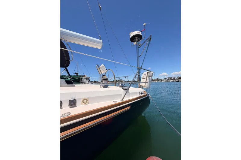 Slide: The Image of 2002 Sabre 362 sailboat docked in a marina under clear blue skies. - 11