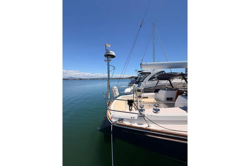 Slide: The Image of Sailboat Sabre 362, 2002 model, docked on calm water under clear blue sky. - 3