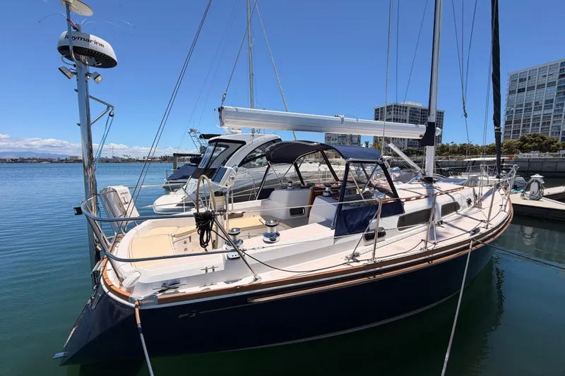 Slide: The Image of 2002 Sabre 362 sailboat docked in a marina under clear blue skies. - 4