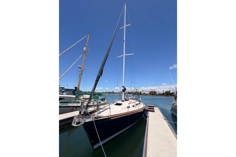 Slide: The Image of 2002 Sabre 362 sailboat docked under clear blue sky. - 8