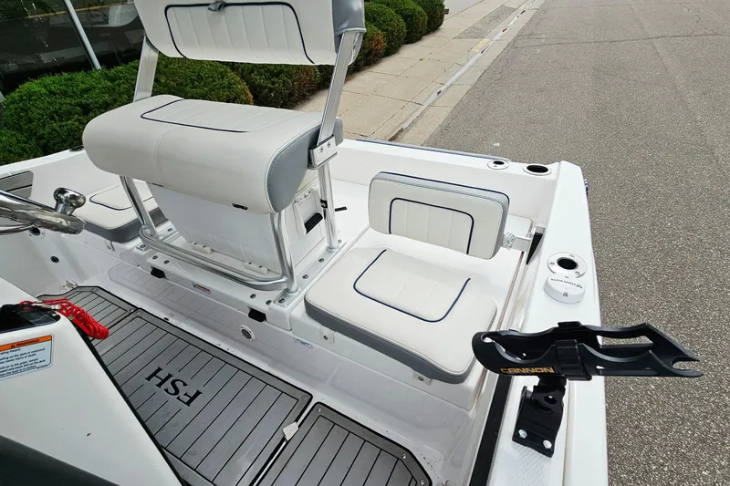 Slide: The Image of 2020 Yamaha Boats 195 FSH Sport interior with white seating and rod holder. - 12