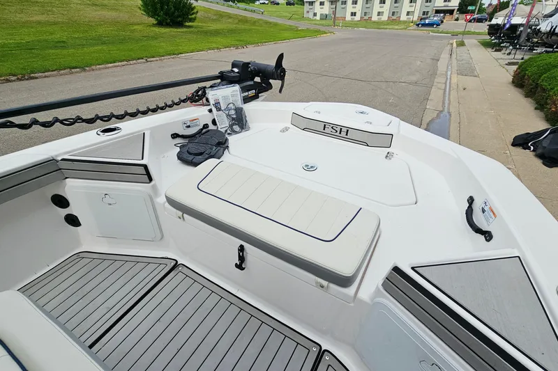 Slide: The Image of 2020 Yamaha Boats 195 FSH Sport interior, featuring sleek seating and modern design elements. - 17