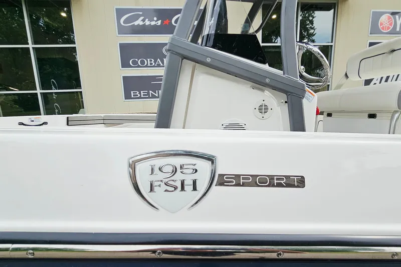 Slide: The Image of 2020 Yamaha Boats 195 FSH Sport, side view with logo and seating area. - 26