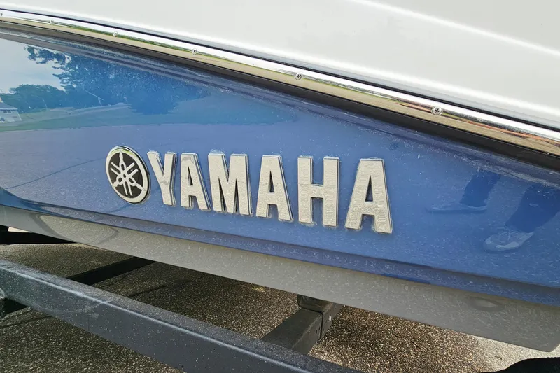 Slide: The Image of 2020 Yamaha Boats 195 FSH Sport logo on blue hull. - 27