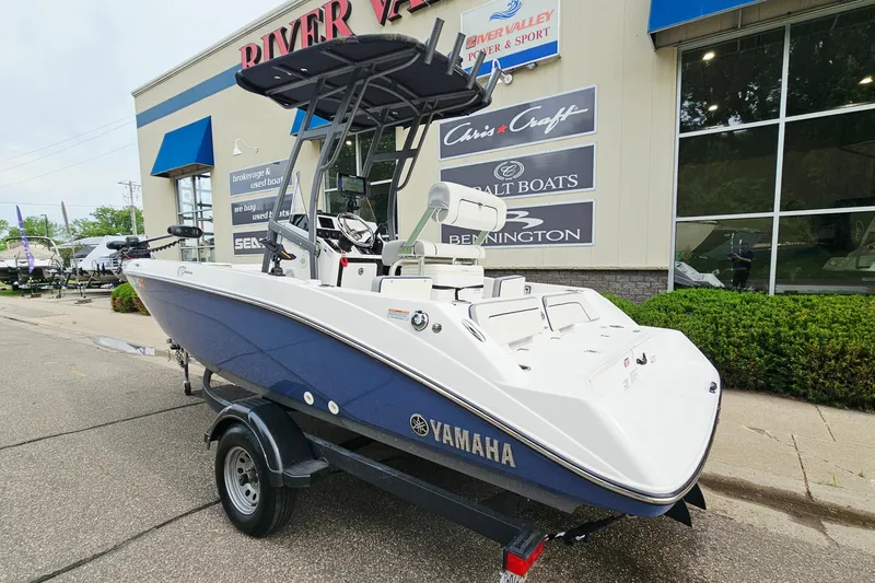 Slide: The Image of 2020 Yamaha Boats 195 FSH Sport displayed outside dealership, featuring sleek design and modern features. - 3