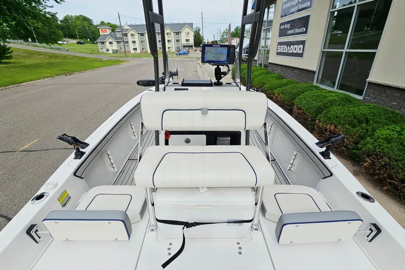 Slide: The Image of 2020 Yamaha Boats 195 FSH Sport interior with seating and navigation equipment. - 8