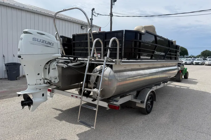 Slide: The Image of 2023 Berkshire 20A CTS pontoon boat with Suzuki outboard motor on trailer. - 14
