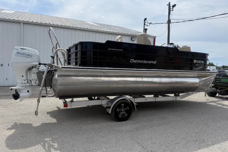 Slide: The Image of 2023 Berkshire 20A CTS pontoon boat with Suzuki outboard motor on trailer. - 15