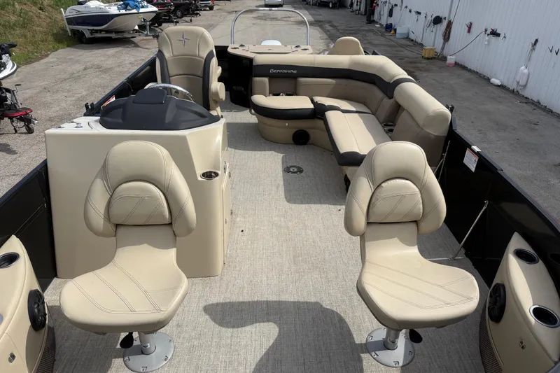 Slide: The Image of 2023 Berkshire 20A CTS pontoon boat with beige seating and modern helm. - 20
