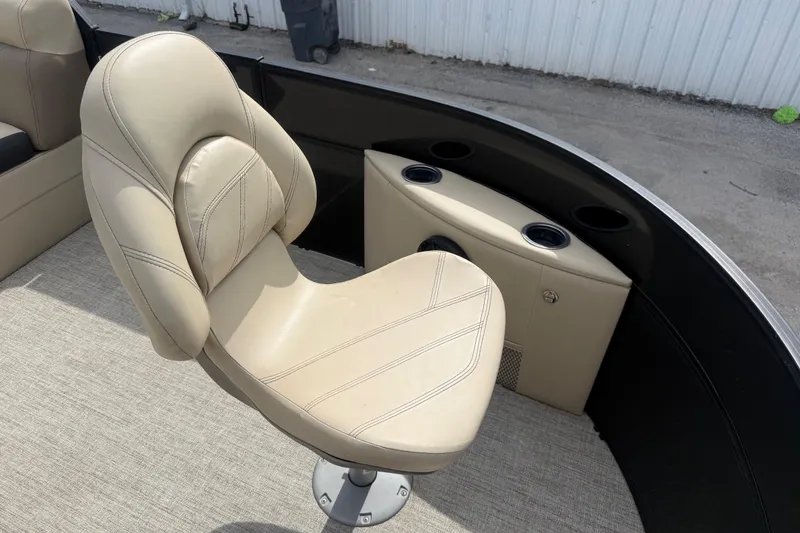 Slide: The Image of Beige captain's chair on 2023 Berkshire 20A CTS boat, with cup holders and storage. - 22