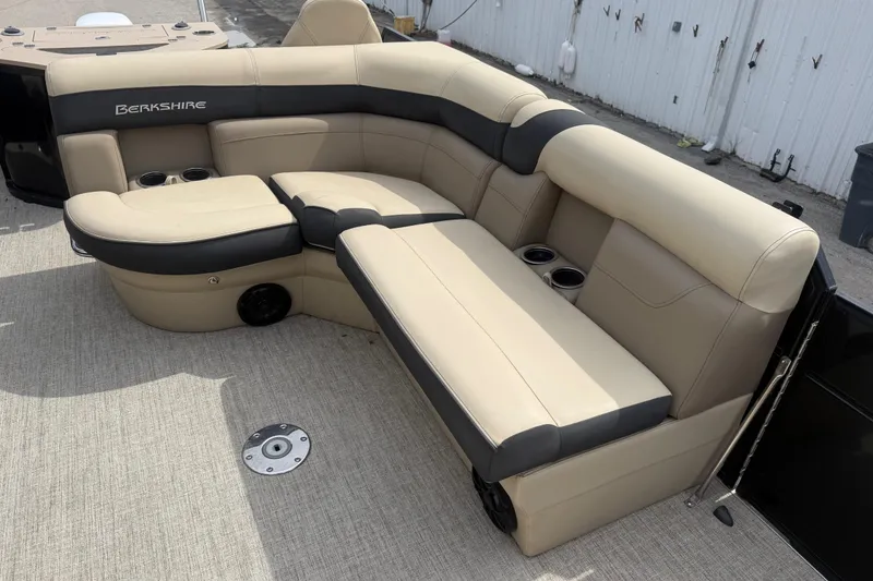 Slide: The Image of Luxurious seating on 2023 Berkshire 20A CTS pontoon boat, featuring beige and black upholstery. - 24