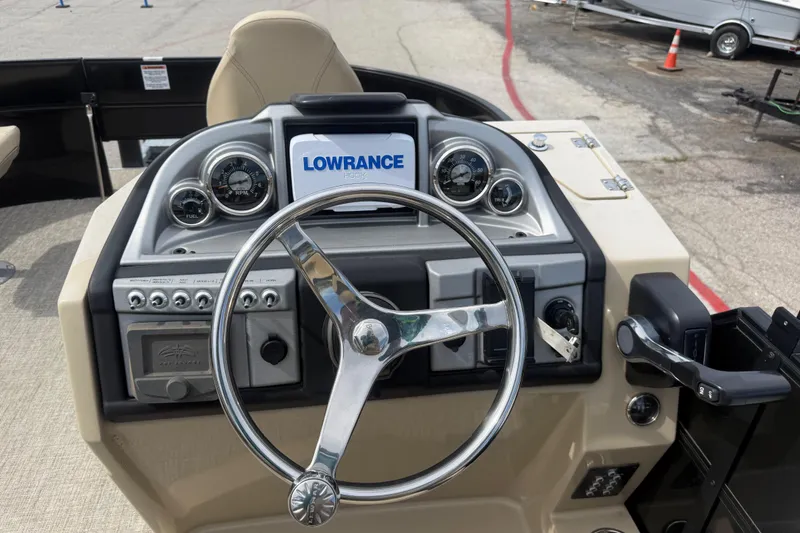 Slide: The Image of Steering console of 2023 Berkshire 20A CTS boat with Lowrance display and gauges. - 26