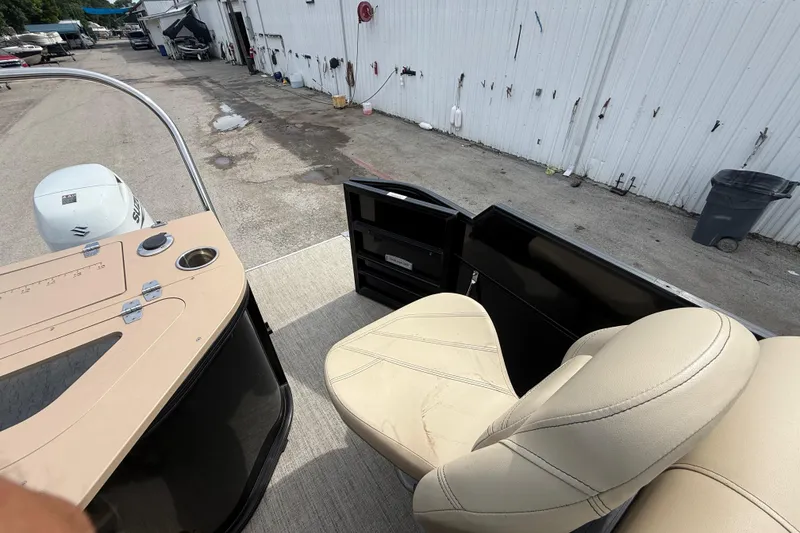 Slide: The Image of Interior of a 2023 Berkshire 20A CTS boat with beige seating and control panel. - 28