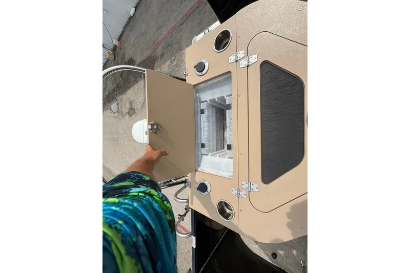 Slide: The Image of 2023 Berkshire 20A CTS boat storage compartment with open hatch, showcasing interior details. - 29
