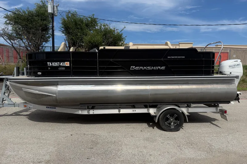 Slide: The Image of 2023 Berkshire 20A CTS pontoon boat on trailer, featuring Suzuki outboard motor. - 5