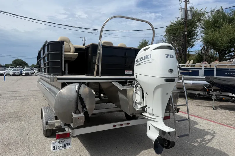 Slide: The Image of 2023 Berkshire 20A CTS pontoon boat with Suzuki 70 outboard motor on trailer. - 9