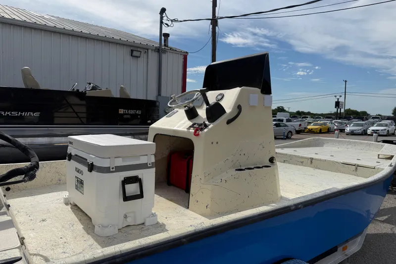Slide: The Image of 2007 Flats Cat 19 boat with console and Igloo cooler on deck. - 14