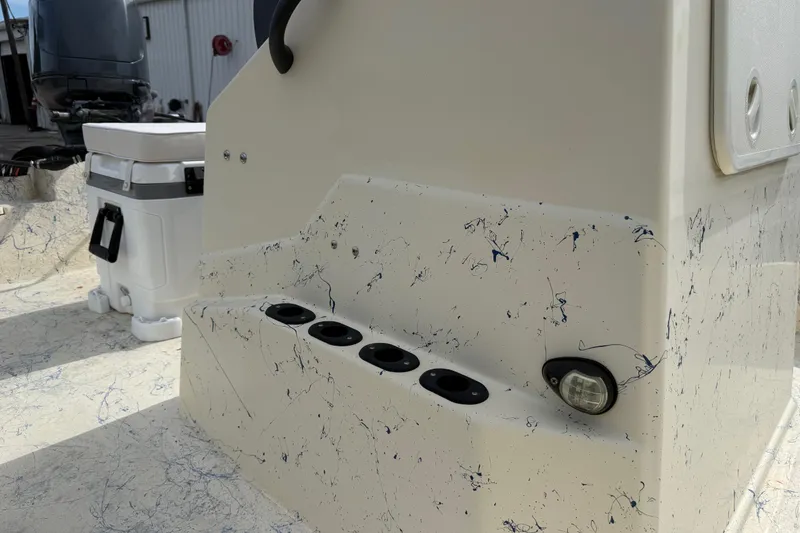 Slide: The Image of 2007 Flats Cat 19 boat interior with rod holders and speckled design. - 20