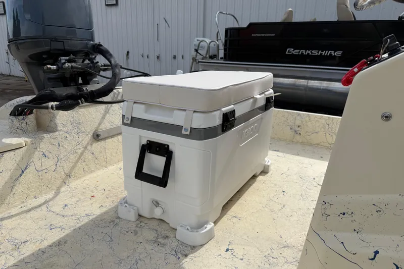 Slide: The Image of 2007 Flats Cat 19 boat interior with cooler and outboard motor. - 21