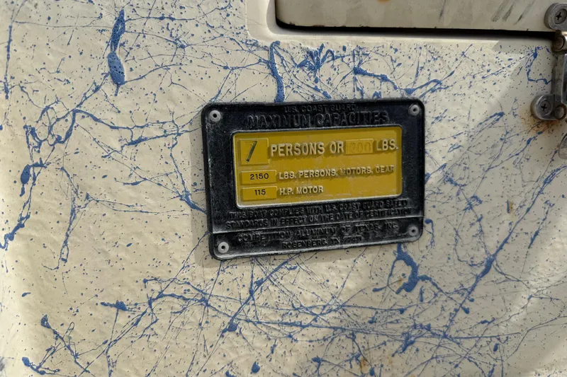 Slide: The Image of 2007 Flats Cat 19 capacity plate, 7 persons or 1200 lbs, blue splatter design. - 22