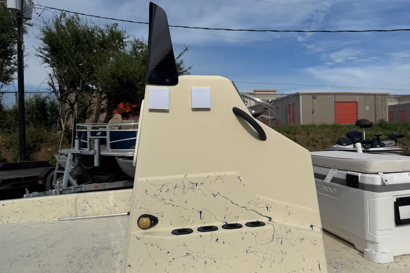 Slide: The Image of 2007 Flats Cat 19 boat console with splatter design, outdoor storage background. - 25