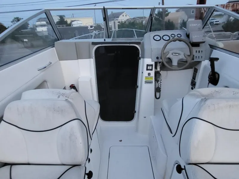 Slide: The Image of Interior of 2000 Bayliner 2252 Ciera Express with helm console. - 10