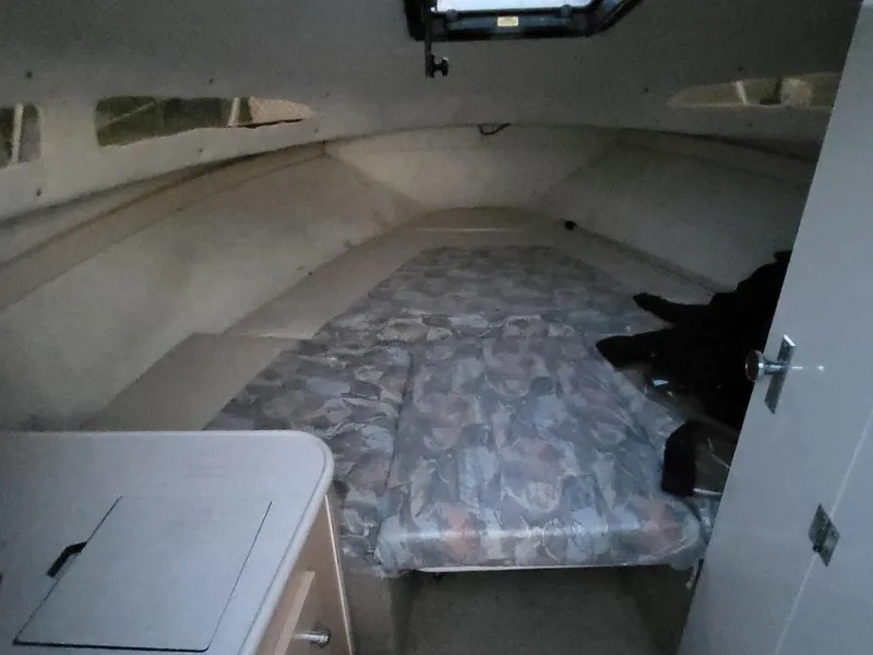 Slide: The Image of Interior of 2000 Bayliner 2252 Ciera Express with sleeping area. - 14