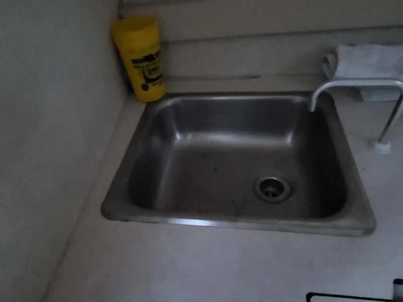 Slide: The Image of Kitchen sink in a 2000 Bayliner 2252 Ciera Express. - 16