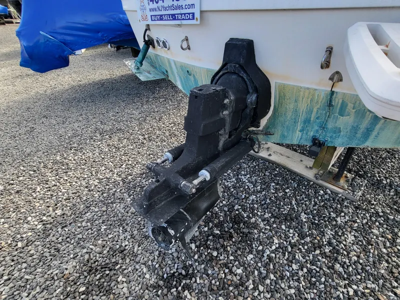 Slide: The Image of 2000 Bayliner 2252 Ciera Express with outboard motor on gravel. - 18