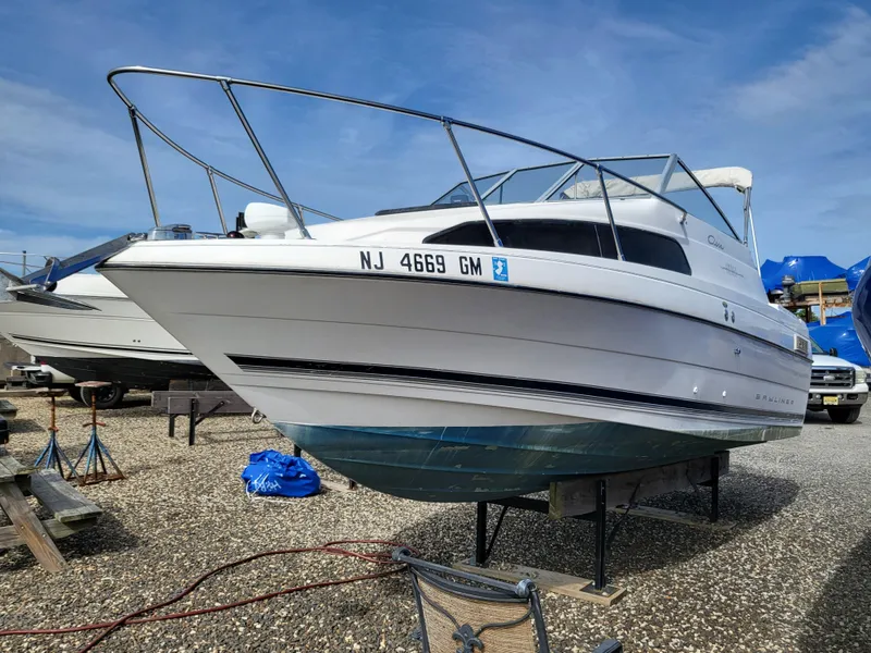 Slide: The Image of 2000 Bayliner 2252 Ciera Express boat docked at marina. - 2