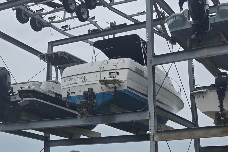 Slide: The Image of 2000 Bayliner 2252 Ciera Express boat stored on metal rack. - 20