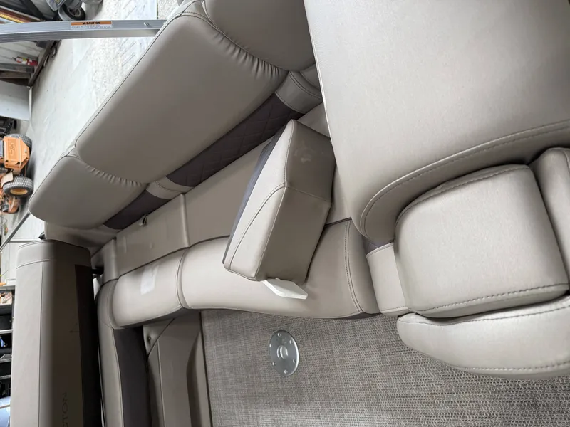 Slide: The Image of Interior of a 2020 Bennington RSB with beige upholstery. - 14