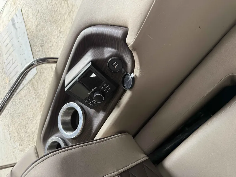 Slide: The Image of Bennington RSB 2020 interior with control panel and cup holders. - 16