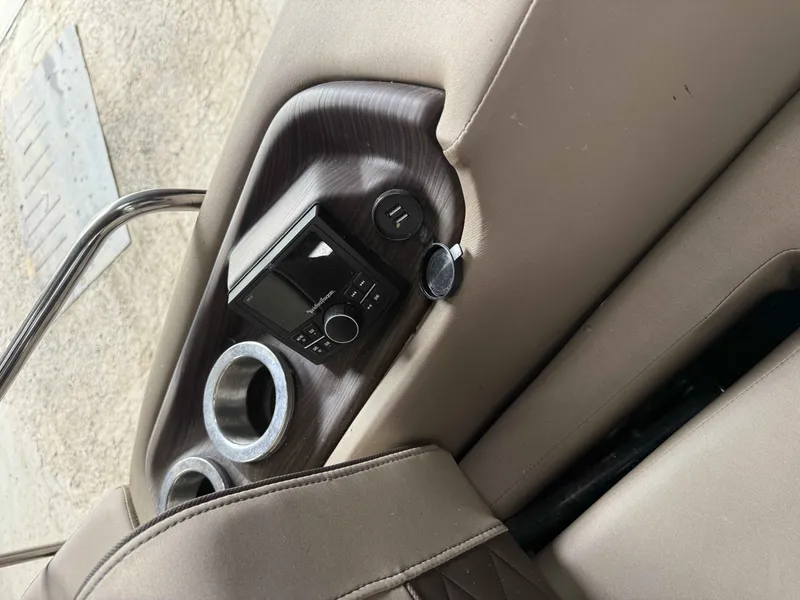 Slide: The Image of Interior of a 2020 Bennington RSB with radio and cup holders. - 3