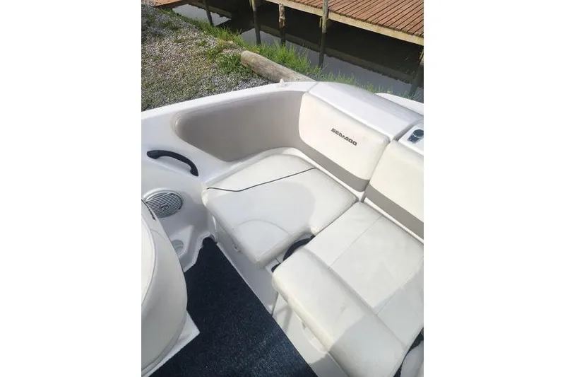 Slide: The Image of Interior seating of 2012 Sea-Doo Sport Boats 180 Challenger, featuring white upholstery. - 17