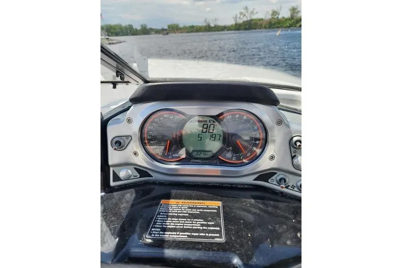 Slide: The Image of Dashboard of a 2012 Sea-Doo Sport Boats 180 Challenger on a lake. - 22