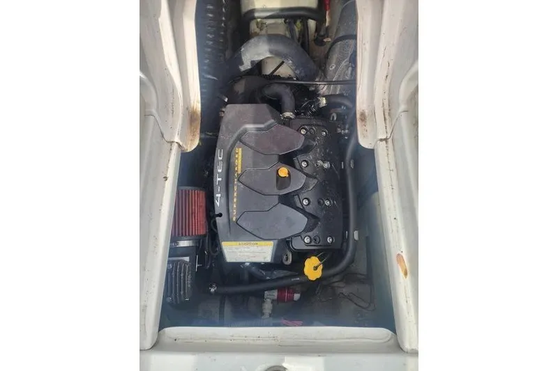 Slide: The Image of Engine compartment of a 2012 Sea-Doo Sport Boats 180 Challenger, featuring a Rotax 4-TEC engine. - 24