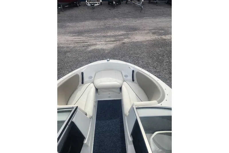 Slide: The Image of 2012 Sea-Doo Sport Boats 180 Challenger bow seating area with white upholstery. - 9