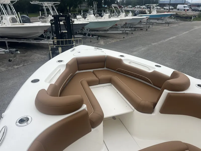 Slide: The Image of Key West 249 FS 2026 with brown seating at the dock. - 10