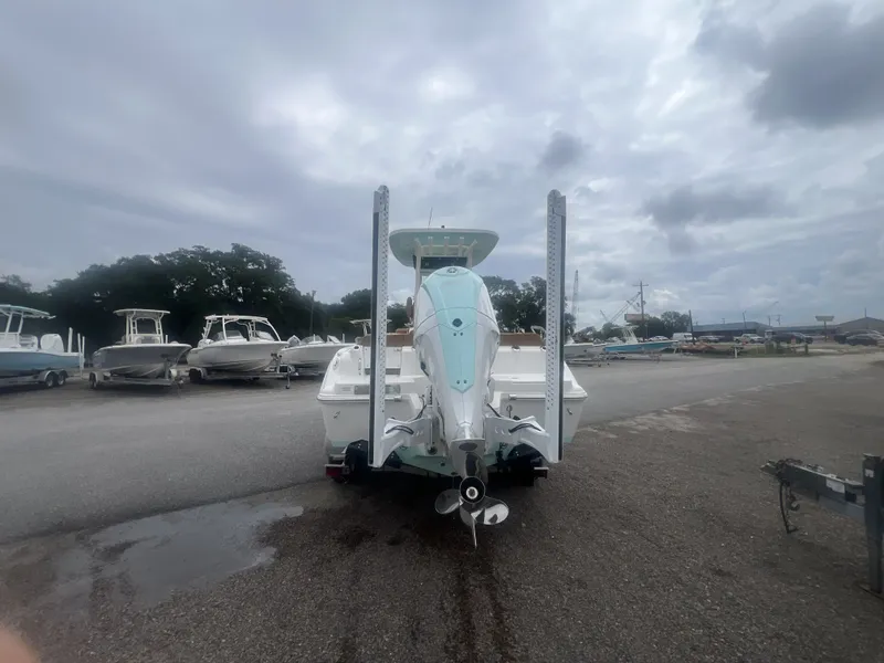 Slide: The Image of Rear view of a 2026 Key West 249 FS boat in a parking lot. - 2