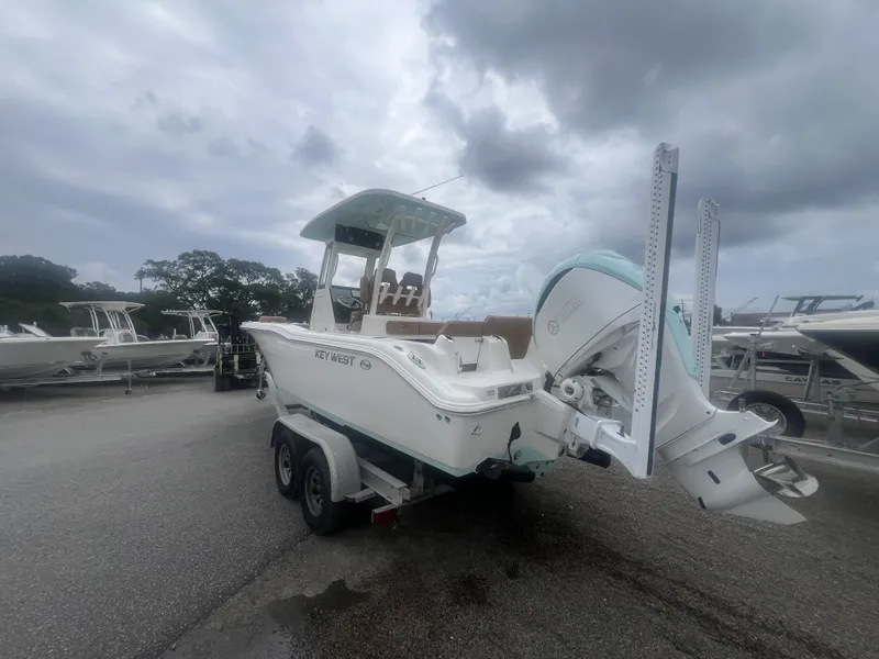 Slide: The Image of 2026 Key West 249 FS boat on trailer under cloudy sky. - 4