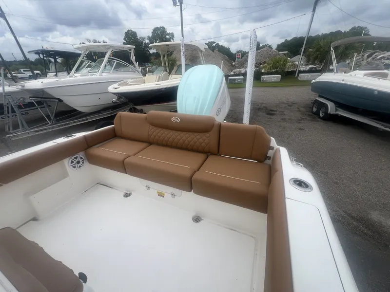 Slide: The Image of Interior of a 2026 Key West 249 FS boat with brown seating. - 6