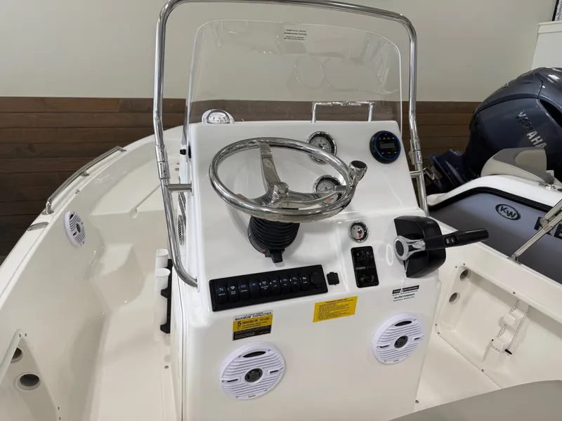 Slide: The Image of Key West 1720 Center Console 2026 with steering and instruments. - 11