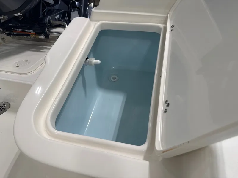 Slide: The Image of Key West 1720 Center Console 2026 with open storage compartment. - 3