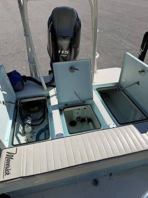 Slide: The Image of 2017 Maverick Mirage 18 HPX-V boat with open storage compartments. - 13