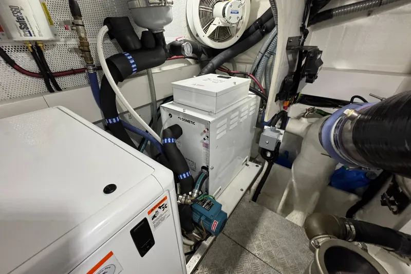 Slide: The Image of Engine room of 2024 Galeon 560 Fly yacht, featuring advanced mechanical systems. - 73
