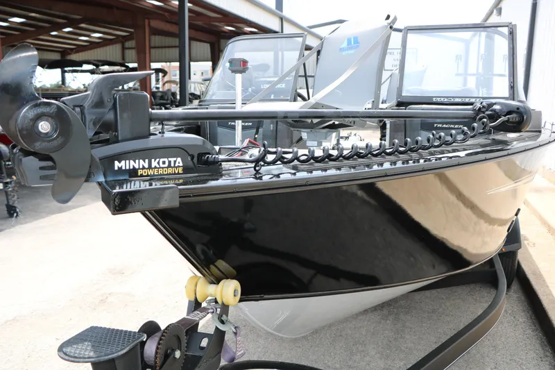 Slide: The Image of 2022 Tracker Targa V-19 Combo boat with Minn Kota PowerDrive motor in a showroom. - 14