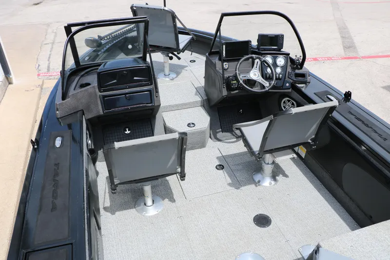 Slide: The Image of 2022 Tracker Targa V-19 Combo boat interior with seating and control panel. - 16