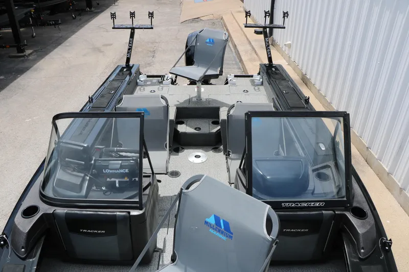 Slide: The Image of 2022 Tracker Targa V-19 Combo boat interior with fishing equipment and seating. - 19